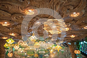 Thai hanging rattan lantern lamps with wooden ceil. Interior decor