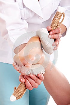 Thai herb compress massage of leg.