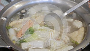 Thai hot pot style suki full of fish ball, vegetable, meat, pork slide