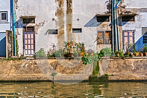 Thai houses along Khlong Rob Krung Canal in Bangkok