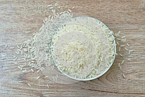 Thai jasmine rice paddy in bowl on wooden table