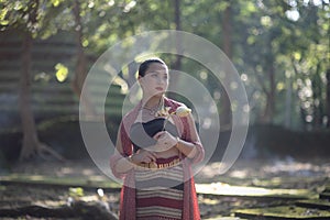 Thai lanna traditionally dressed women in the Old temple in Thailand.