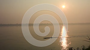 Thai and laos people riding long tail boat for catch fishing in Mekhong River