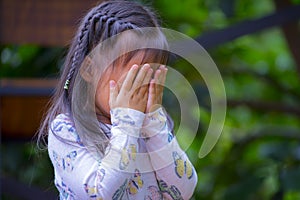 Thai Little girl praying, crying, hopelessness, despair or Prayer