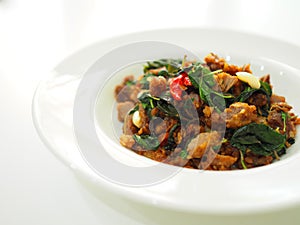 Thai local traditional food: stir fried crispy duck chopped meat with holy basil