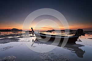 Thai long tail boat at sunrise of seascape in Phuket, Thailand.