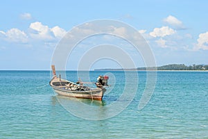Thai longtail boat at Naiyang beach with blue sky