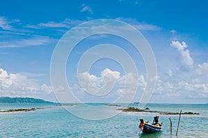 Thai Longtail Fishing Boat at Koh Tean near Samui island in summer day with blue sky
