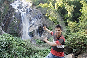 Thai man with Mae Tia Waterfall, Obluang National Park