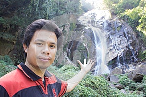 Thai man with Mae Tia Waterfall, Obluang National Park, Chiangmai