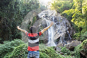 Thai man with Mae Tia Waterfall, Obluang National Park, Chiangmai