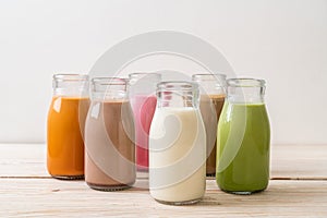 Thai milk tea, matcha green tea latte, coffee, chocolate milk, pink milk and fresh milk in bottle