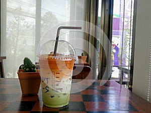 Thai milk tea mix with Green tea Cold drink on a table