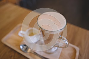 Thai milk tea on wooden table