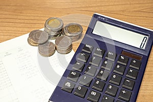 Thai money and book bank saving account on wooden table