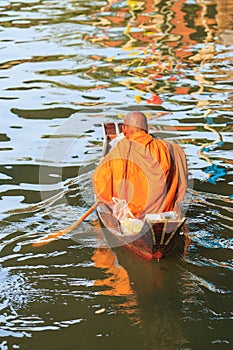 Thai monk on boat