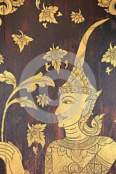 Thai mural painting on gate of Wat Pong Sanuk Nua, Lampang, Thai photo