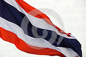 Thai national flag waves on the sky