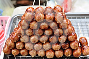 Thai Northeast sausages arranged like pyramid layers.