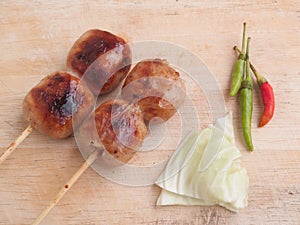 Thai northeastern or Isan sausage with cabbage and chilli