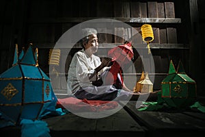 Thai old women made the lantern for yeepeng festival