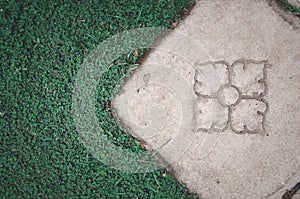 Thai outdoor brick flooring pattern with green grass