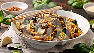 Thai Pad See Ew with beef, eggs, vegetables and rice noodles.