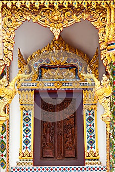 thai painting craved window with mosaic frame