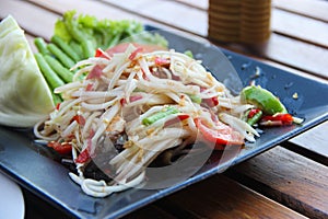 Thai papaya salad serve with vegetables