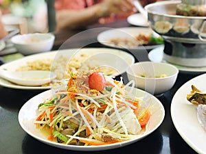 Thai papaya salad on wooden table, thai food.