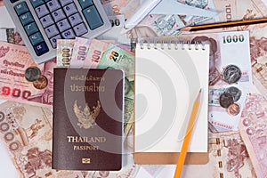 Thai Passport with Thai money banknote, Thai coin and airplane.