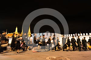 Thai people walking into Grand Palace to paying respect to the late King Bhumibol Adulyadej at night.
