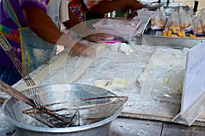 Thai people cooking deep-fried doughstick or Youtiao