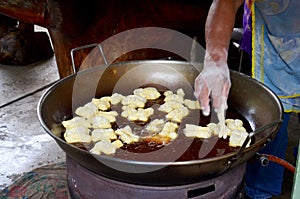 Thai people cooking deep-fried doughstick or Youtiao