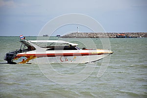Thai people driving speed boat floating in the sea at Ban Pae beach in Rayong, Thailand