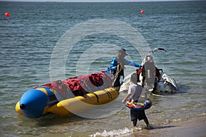 Thai people and foreign travelers travel visit play swimming wave water in sea and ride playing jetski banana boat in ocean of