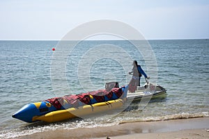 Thai people and foreign travelers travel visit play swimming wave water in sea and ride playing jetski banana boat in ocean of