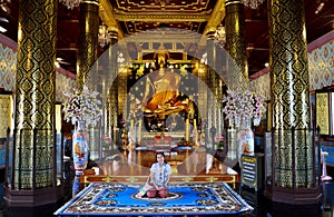 Thai people praying Buddha statue name Phra phuttha chinnarat at