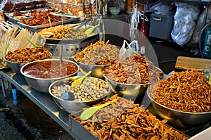 Thai people travel and shopping food at Don Wai Floating Market