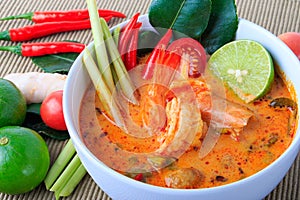 Thai Prawn Soup with Lemongrass (Tom Yum Goong) On Brown Cloth Background.