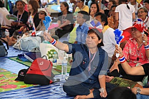 Thai protesters wave hand clappers to anti government