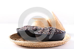 Thai purple glutinous rice grain in a black bowl