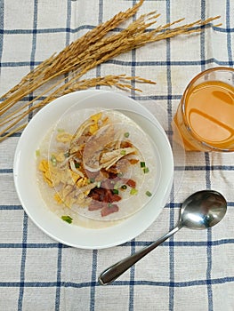 Thai rice congee with shreded chicken and egg slices