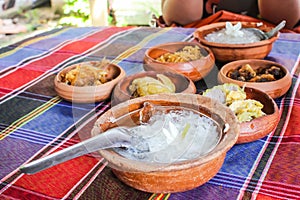 Thai rice in ice water put cup of clay for appetizers place on table