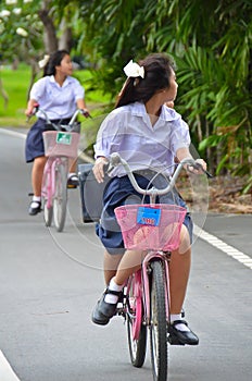 Thai Schoolgirl riding a bicycle