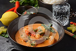 Thai shrimps red curry. Thailand tradition red curry soup with shrimps prawns and coconut milk.