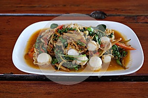 Thai sizzling spicy fried scallop serves on the dish