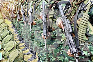 Thai soldiers stand in row.commando soldiers in camouflage uniforms gun in hand