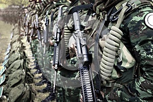 Thai soldiers stand in row.commando soldiers in camouflage uniforms gun in hand