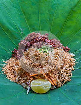 Thai Southern Rice Salad with Herb Vegetables on Lotus leaf with selective focus